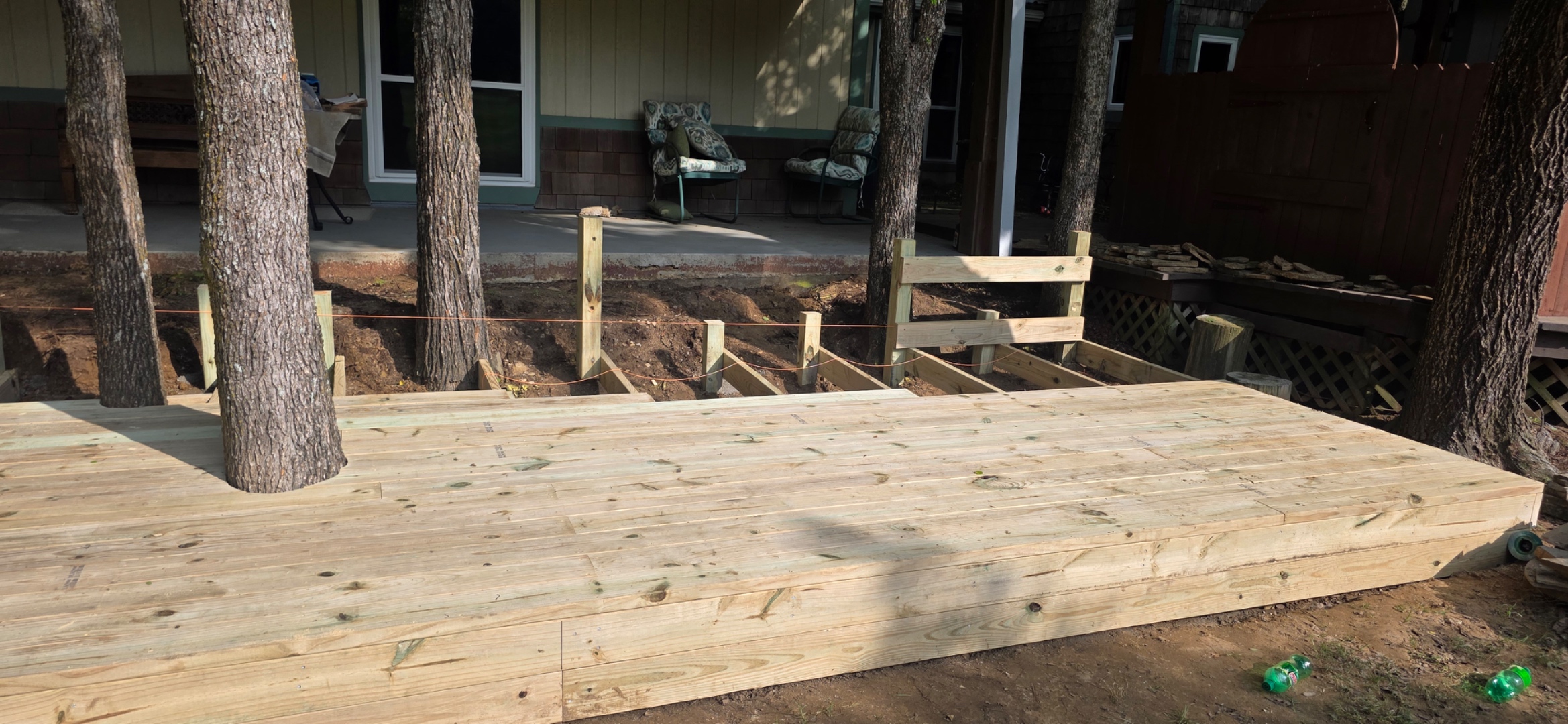 Deck boards going down — mid-construction progress shot
